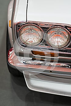 Close up Color detail on the headlight of a vintage car