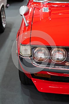 Close up Color detail on the headlight of a vintage car