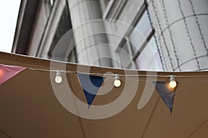 Close-up of colored flags on the ceiling