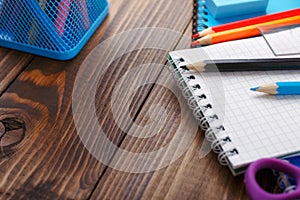 Close up of colored pencils with a notebook