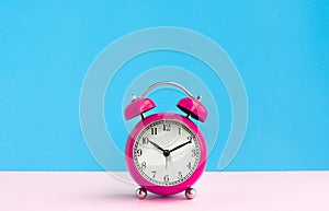 Close up colorful alarm clock on pastel background.timing concepts