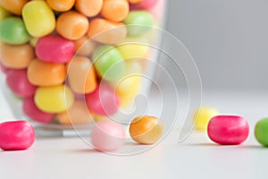 Close up of colorful candy drops on table