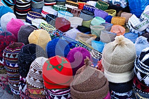 Close up of colorful caps for sale in a market in a souk in the Medina around the Jemaa el-Fnaa square in Marrakesh