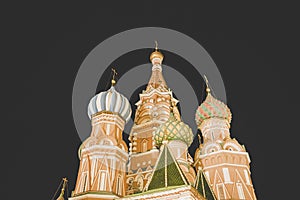 Close up of colorful domes of St. Basil's cathedral in Moscow at dark night. Beautiful patterned domes of Pokrovsky Cathedral,