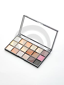 Close up of colorful eyeshadow palette isolated on white background. Open makeup case. Trendy pastel and bright colors for visage