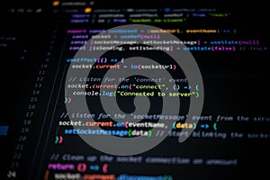 Close-up of colorful JavaScript code on computer screen, showing socket connection and server communication for modern web