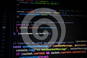 Close-up of colorful JavaScript source code on computer screen, showing socket communication function for modern web development,