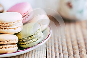 Close up on colorful macarons in a cup