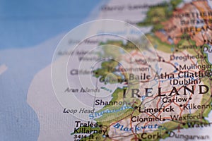 Close up of a colorful map focusing on Limerick, Ireland through selective focus, background blur