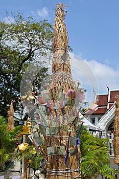 Close-up of a colorful \'money tree\' formed by placing bank notes on split bamboo holders, at a Thai temple