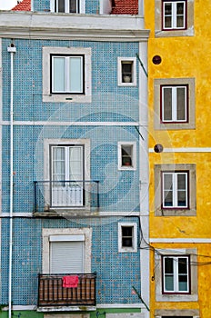 Close up of colorful old houses and windows. Lisbon, Portugal. Color blocks architecture vertical background