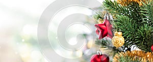 Close up of colorful ornaments on Christmas tree, panoramic banner