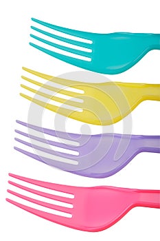 Close up of colorful plastic forks isolated on white background