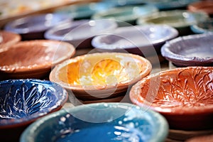close-up of colorful pottery glazes on palette