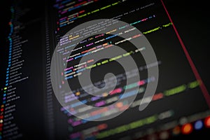 Close-up of colorful programming code on screen showing editUser function with async payload and statusCode, symbolizing software