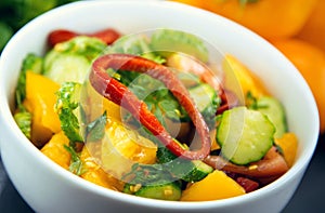 Close Up of colorful salad from tomatoes, cucumbers, peppers and