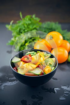 Close Up of colorful salad from tomatoes, cucumbers, peppers and