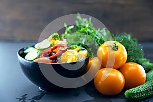 Close Up of colorful salad from tomatoes, cucumbers, peppers and