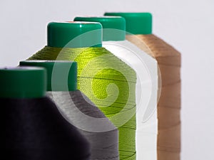 A close-up of colorful spools of thread,