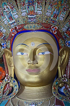 Colorful statue of Maitreya Buddha at Tibetan Buddhist Thiksey Monastery near mountain village Leh in ladakh region, north India