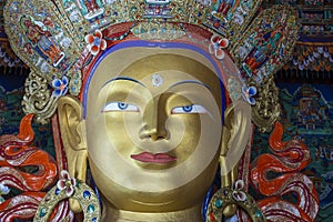 Colorful statue of Maitreya Buddha at Tibetan Buddhist Thiksey Monastery near mountain village Leh in ladakh region, north India