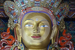 Colorful statue of Maitreya Buddha at Tibetan Buddhist Thiksey Monastery near mountain village Leh in ladakh region, north India