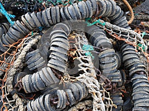 close up of colorful tangled old fishing net rope and floats
