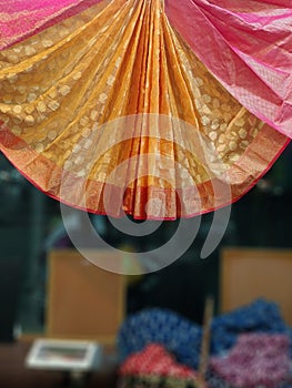 Close up of Colorful traditional Sari, saree displayed in India. natural silk, cotton fold fabric texture. Indian Handloom cotton