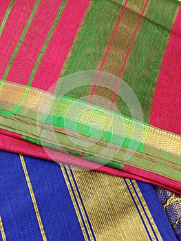 Close up of Colorful traditional Sari, saree displayed in India. natural silk, cotton fold fabric texture. Indian Handloom cotton