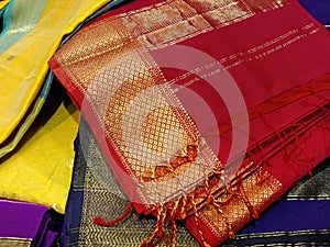 Close up of Colorful traditional Sari, saree displayed in India. natural silk, cotton fold fabric texture. Indian Handloom cotton