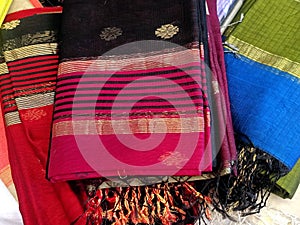 Close up of Colorful traditional Sari, saree displayed in India. natural silk, cotton fold fabric texture. Indian Handloom cotton