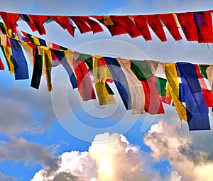 Close up of colourful Tibetan prayer flags in sky, Boudhanath, Nepal