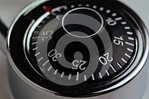 Close up of combination lock with circle of numbers and code to unlock using as security, safety and hacking concept