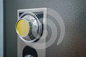 Close up of combination safe with yellow knob