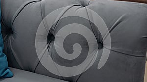 Close-up of a comfortable gray sofa. 4k video.