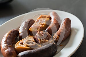 Close up of compango, side dish with meat, chorizo, jam and blood sausages to add the traditional meal in Asturias, fabada. photo
