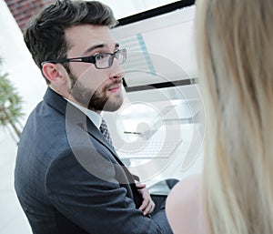 Close-up of the company`s employees work with financial information