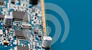 Close Up of Computer Circuit Board with Electronic Components on Blue Background