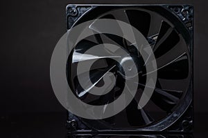 Close up of computer fan on a black background
