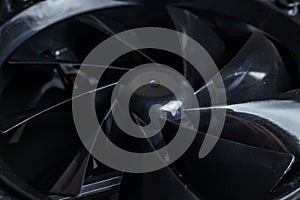 Close up of computer fan on a black background