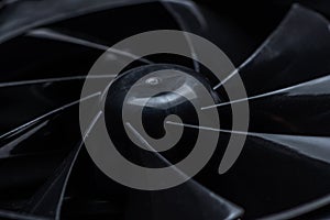 Close up of computer fan on a black background