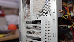 Close-up computer fans in dirt and dust on a computer