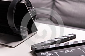 Close Up Of Computer Headphones And Clapperboard