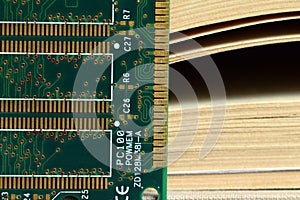 Computer RAM Random Access Memory and a book.