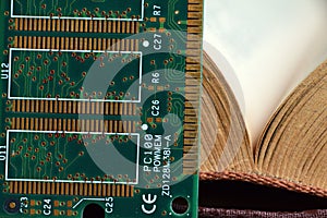 Computer RAM Random Access Memory and a book.