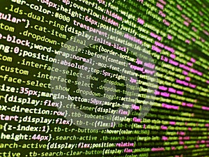 Close up of computer web page code inside of html file. Closeup of Web Code on Computer LED Screen. Developer software programming
