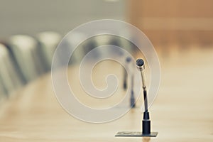 Close up the conference microphones on the meeting table or board room for speaker and workshop