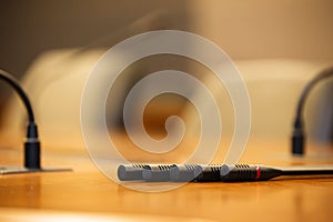 Close up the conference microphones on the meeting table or board room for speaker and workshop