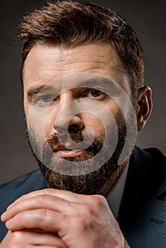 close up of confident bearded man with