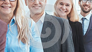 close up. confident young businessman standing in front of his